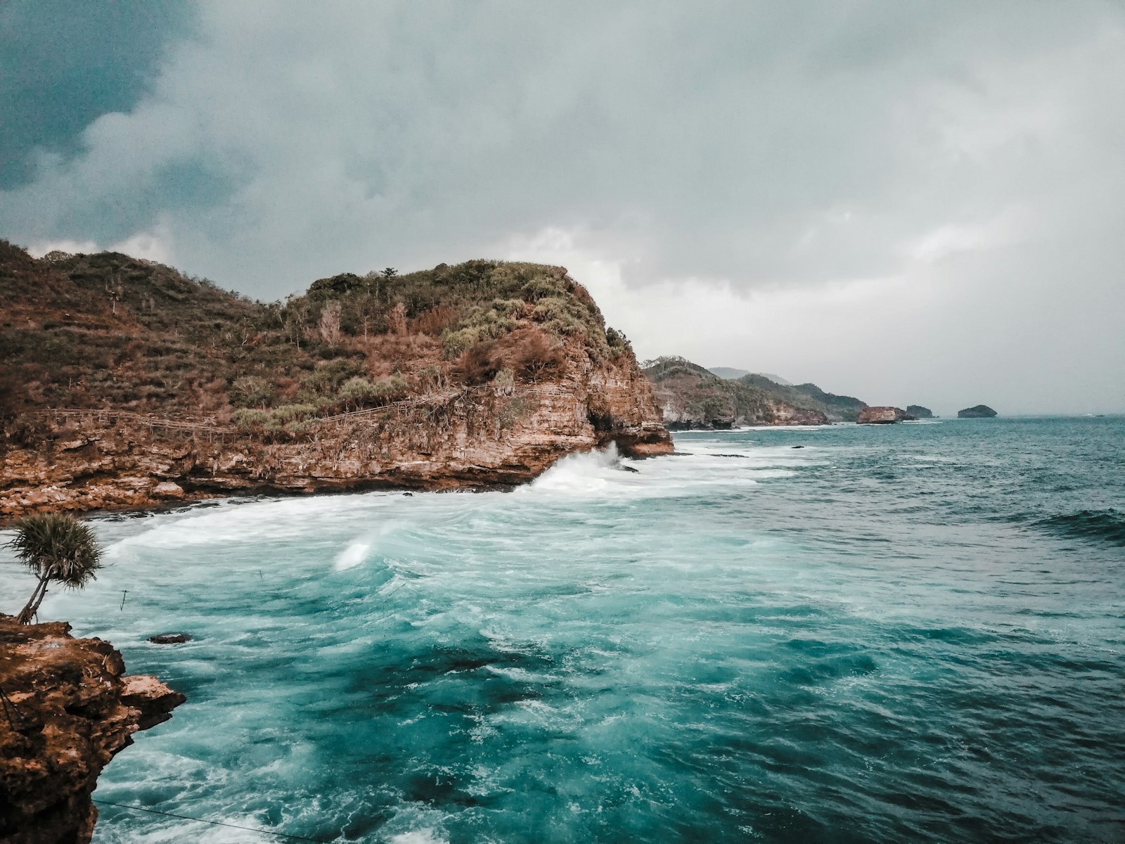a body of water near a rocky shore